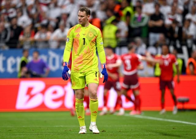 Neuer stands stunned after the swiss goal