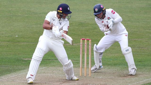 Kent batsman, Beyers Swanepoel is out caught by Lancashire wicketkeeper, Matty Hurst off the bowling of Nathan Lyon