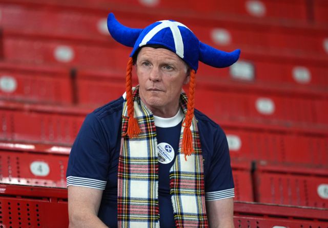 A dejected Scotland fan in Stuttgart
