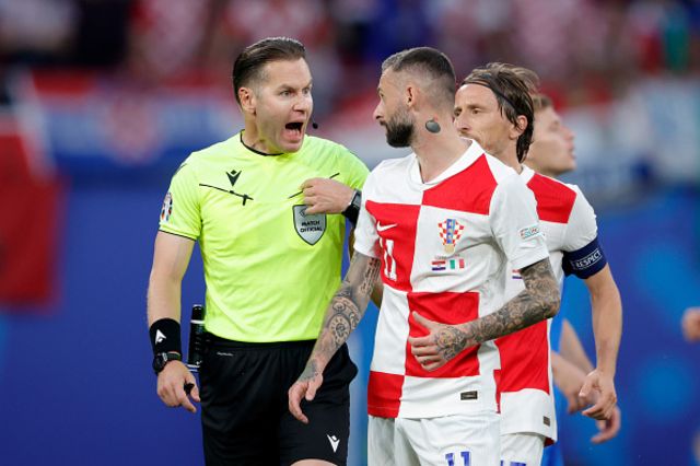 : Marcelo Brozovic of Croatia argues with referee Danny Makkelie