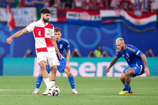Josko Gvardiol of Croatia kicks the ball