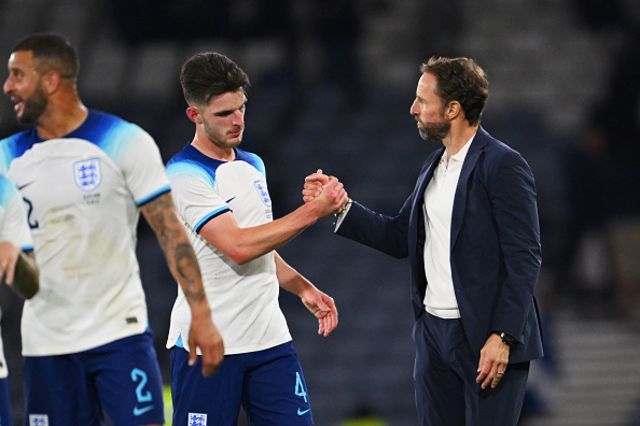 Declan Rice of England interacts with Gareth Southgate