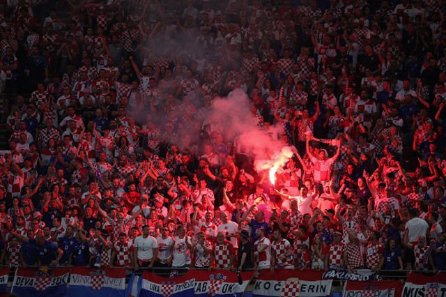 Croatia fans light flares in the crowd