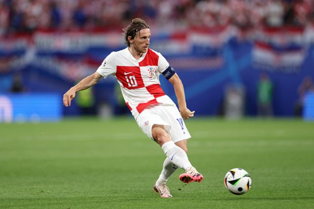 Luka Modric of Croatia passes the ball