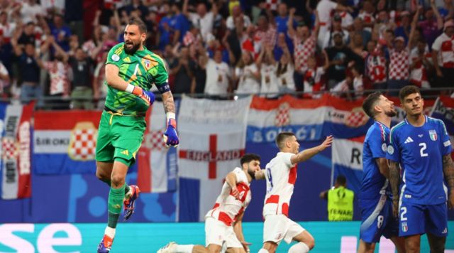 Italy's Gianluigi Donnarumma reacts after Croatia's Luka Modric scores their first goal