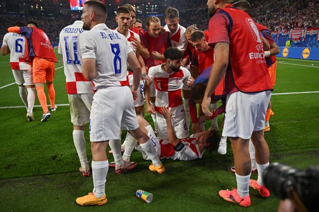 Luka Modric of Croatia celebrates with teammates