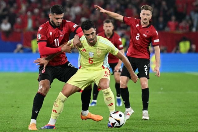 Albania's forward #11 Armando Broja fights for the ball with Spain's midfielder #06 Mikel Merino