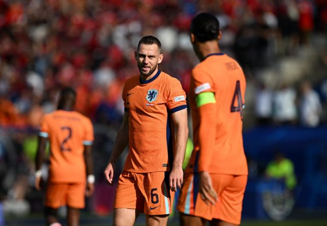 Netherlands' Stefan de Vrij and Virgil van Dijk looks dejected after Donyell Malen scores Austria's first with an own goal