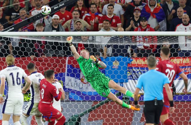 Jordan Pickford makes a save for England against Serbia at Euro 2024