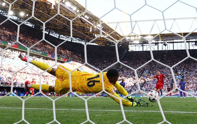 Poland's Robert Lewandowski has his penalty saved by France's Mike Maignan but it is later retaken