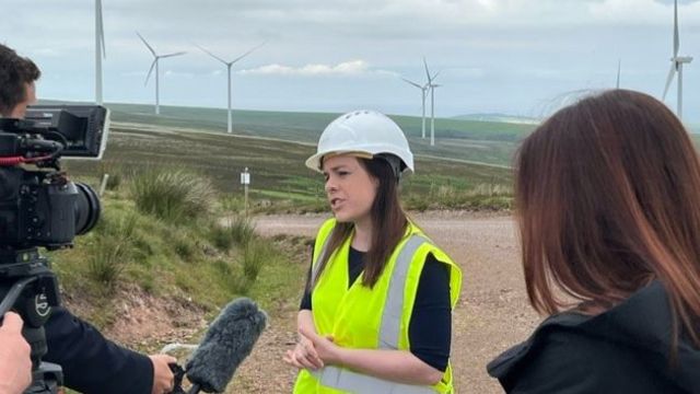 Kate Forbes speaks to media from a wind farm in East Lothian