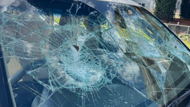 The charity posted an image of a smashed windscreen on X