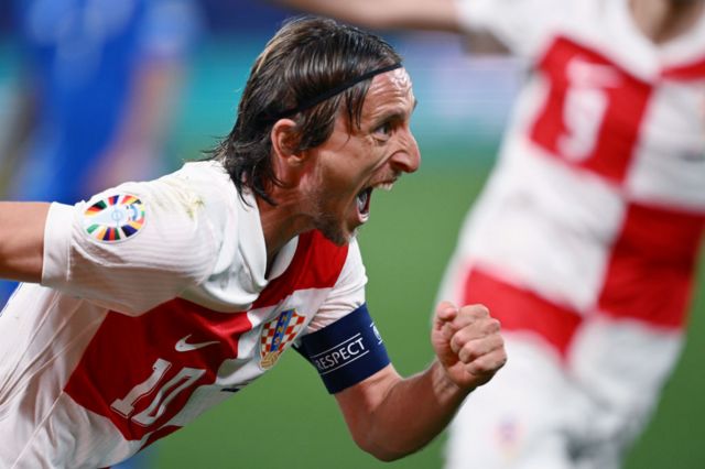 Luka Modric celebrates scoring against Italy
