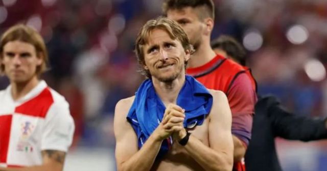 Luka Modric applauds Croatia's fans at the end of their game with Italy