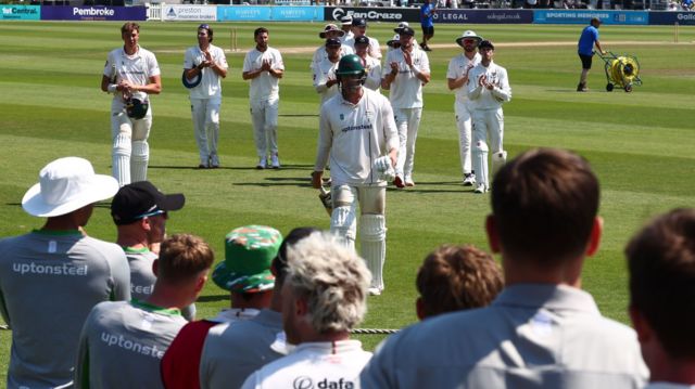 Louis Kimber is applauded off the field at Hove