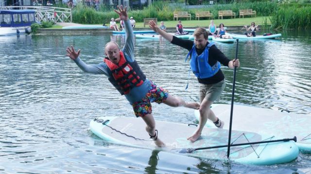 Liberal Democrat leader Sir Ed Davey falls off a paddleboard