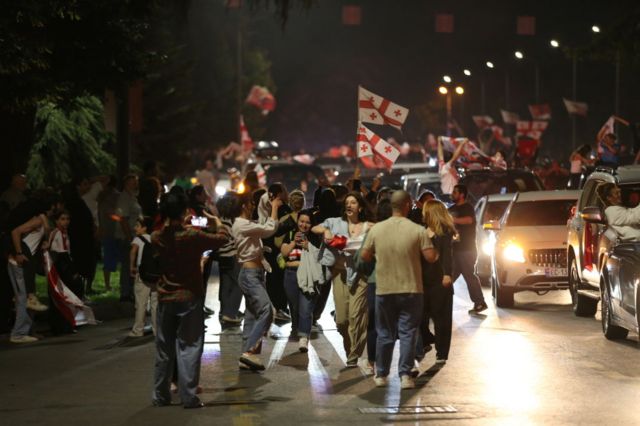Georgia fans celebrate on the street in Tblisi