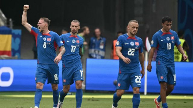 Slovakia players celebrate a goal against Romania during a Euro 2024 Group E match