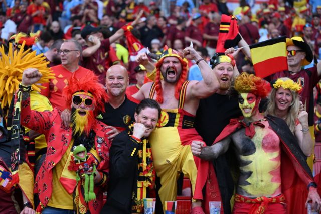 Belgium fans dressed in the black, yellow and red