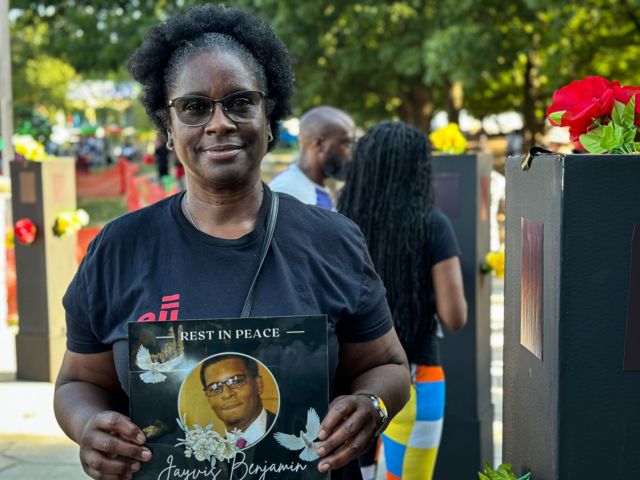 Montye Benjamin, 60, holds a picture of her son, Jayvis, who was shot and killed by police in 2013.