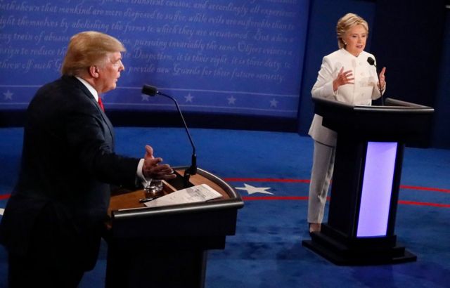 Donald Trump gestures as Hillary Clinton speaks during the final presidential debate of 2016 in Las Vegas, Nevada