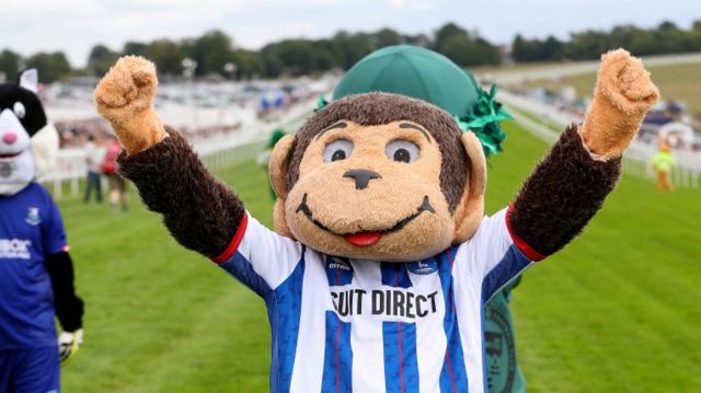 Hartlepool mascot H'Angus the Mascot celebrating victory in the mascot race as Epsom Races in 2022
