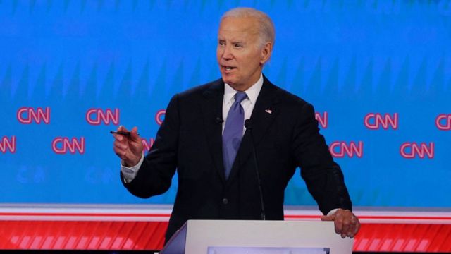 President Biden points while answering a question at the debate