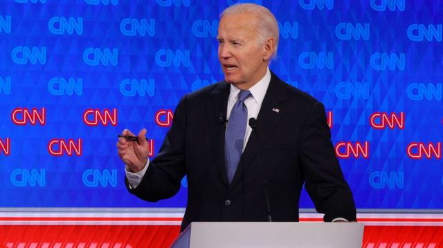 President Joe Biden motions during an answer at the debate