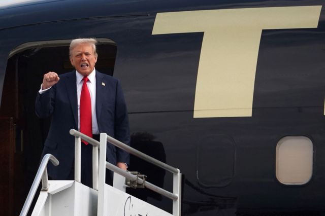 Donald Trump arrives in Atlanta and is seen disembarking from his plane.