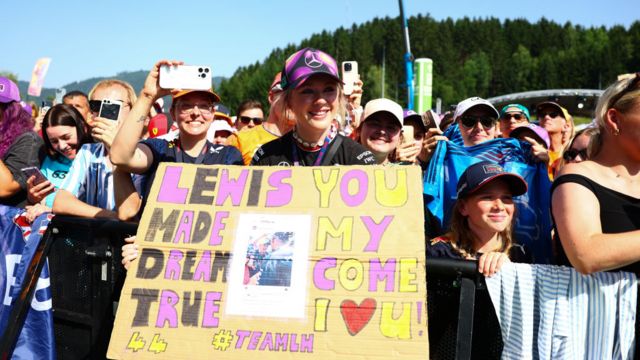 Fans in Austria hold Lewis Hamilton signs