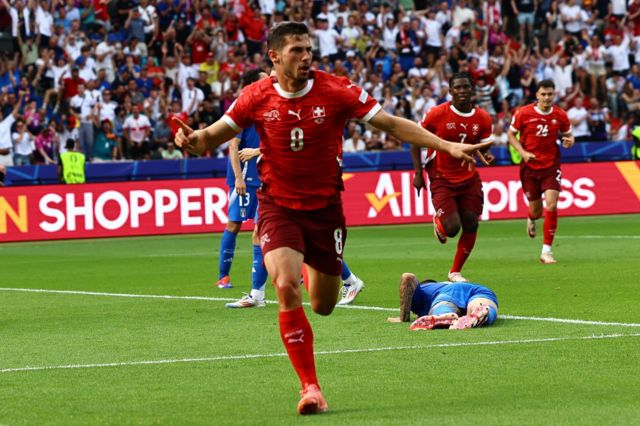 Remo Freuler of Switzerland celebrates after scoring the 1-0 goal during the UEFA EURO 2024 Round of 16 soccer match between Switzerland and Italy