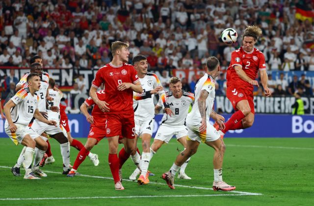 Denmark's Joachim Andersen heads at goal