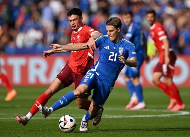 Italy's Nicolo Fagioli in action with Switzerland's Fabian Rieder