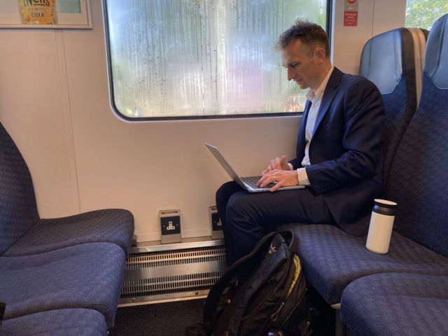 Harry Farley on a train