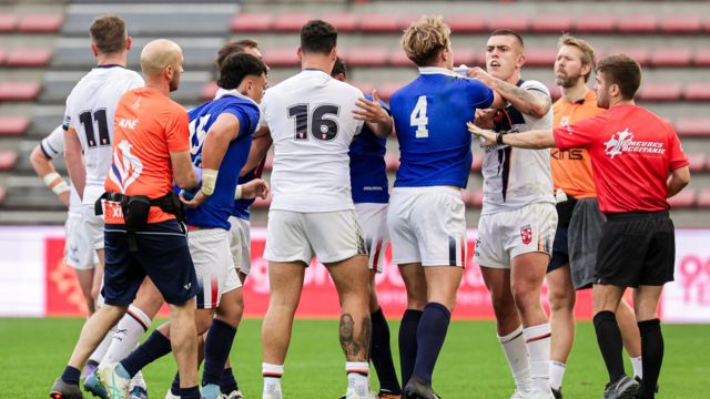 England and France players confront each other