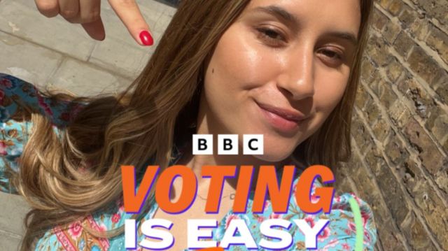 Selfie picture of a woman pointing to graphics that say Voting Is Easy