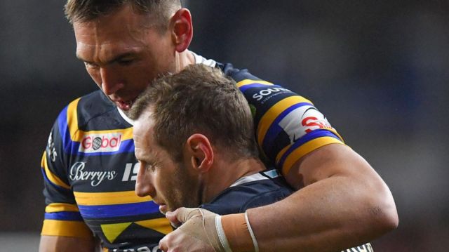 Sinfield holds his arm around Burrow