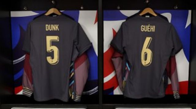 The shirts of Lewis Dunk and Marc Guehi of England are seen in the England dressing room
