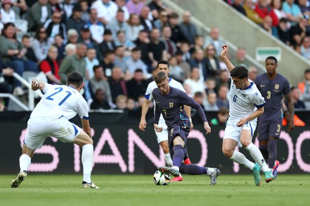 Cole Palmer of England battles for possession with Benjamin Tahirovic
