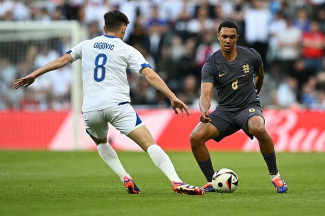Armin Gigovic (L) vies with England's defender Trent Alexander-Arnold