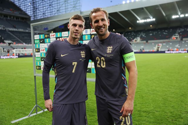 Cole Palmer and Harry Kane of England pose for a photo
