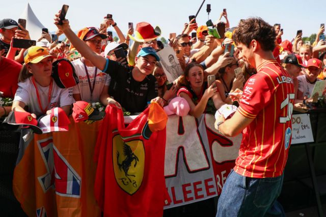 Charles Leclerc signs autograph for fans