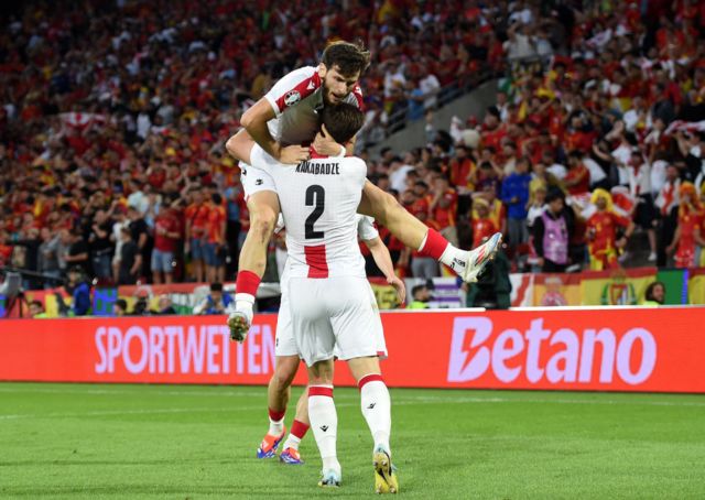 Georgia players celebrate scoring against Spain
