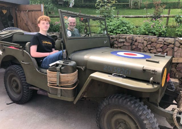 Richard Gibson in his Jeep