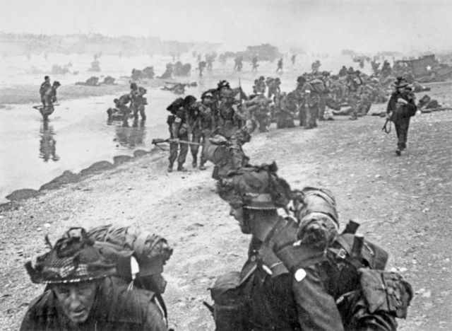 Archive D-Day image of soldiers landing on Sword Beach
