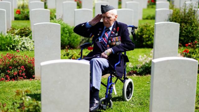RAF veteran Bernard Morgan, 100, salutes the fallen at Bayeux War Cemetery