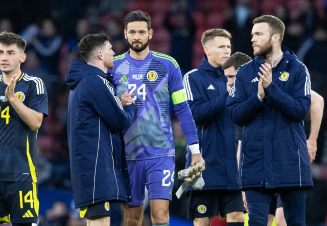 Andy Robertson has a word with Craig Gordon at full-time