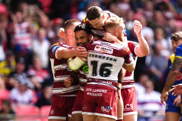 Bevan French celebrates his try for Wigan against Warrington