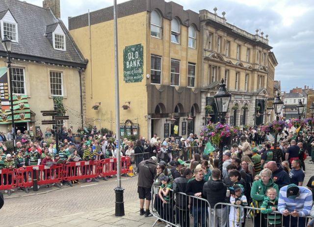 Fans at the Guildhall area of Northampton ahead of the parade