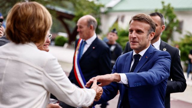 President Macron shakes hands of voters